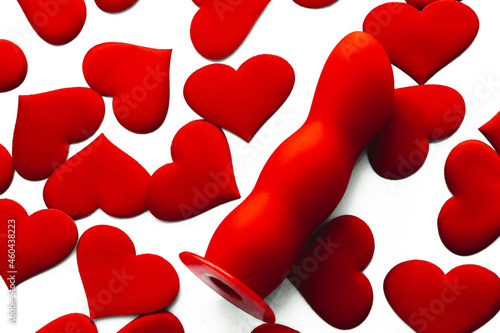 red dildo with lots of hearts symbolizes the love of masturbation and nymphomania; design for intimate services