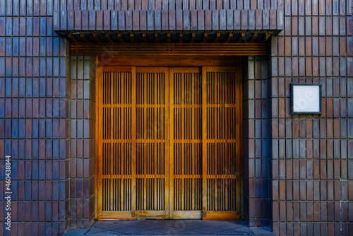 格子の扉と白い表札　タイル張りの和風の建物 photo