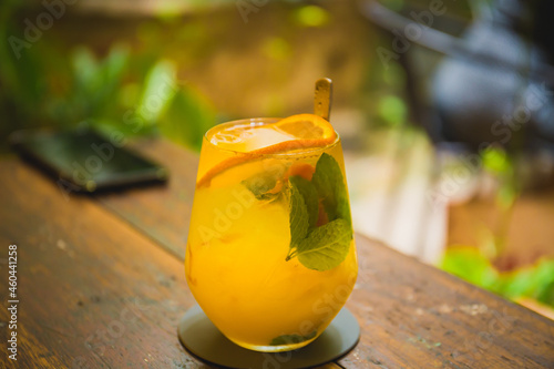 A closed up shot of a orange and mango mocktail served at a hipster cafe at Malacca, Malaysia.