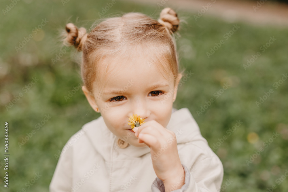 Autumnal mood. Portrait of a little cute girl walking in the autumn park Autumnal mood. Portrait of a little cute girl walking in the autumn park