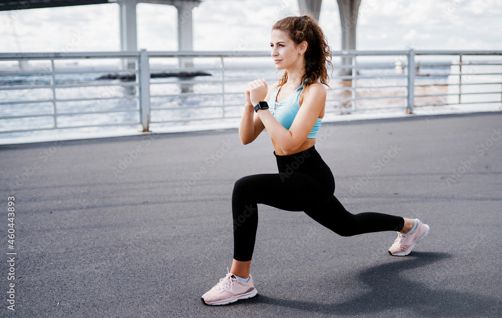 Comfortable clothes for women. Does sports in the city. The trainer does warm-up exercises before training. The athlete leads a healthy lifestyle. Cardio training for weight loss. Comfortable clothes for women. Does sports in the city. The trainer does warm-up exercises before training. The athlete leads a healthy lifestyle. Cardio training for weight loss.