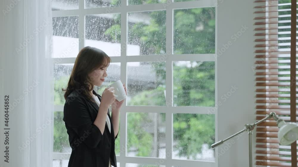 businesswoman or office worker standing by the window sipping coffee contemplating a project he is working on.
businesswoman or office worker standing by the window sipping coffee contemplating a project he is working on.