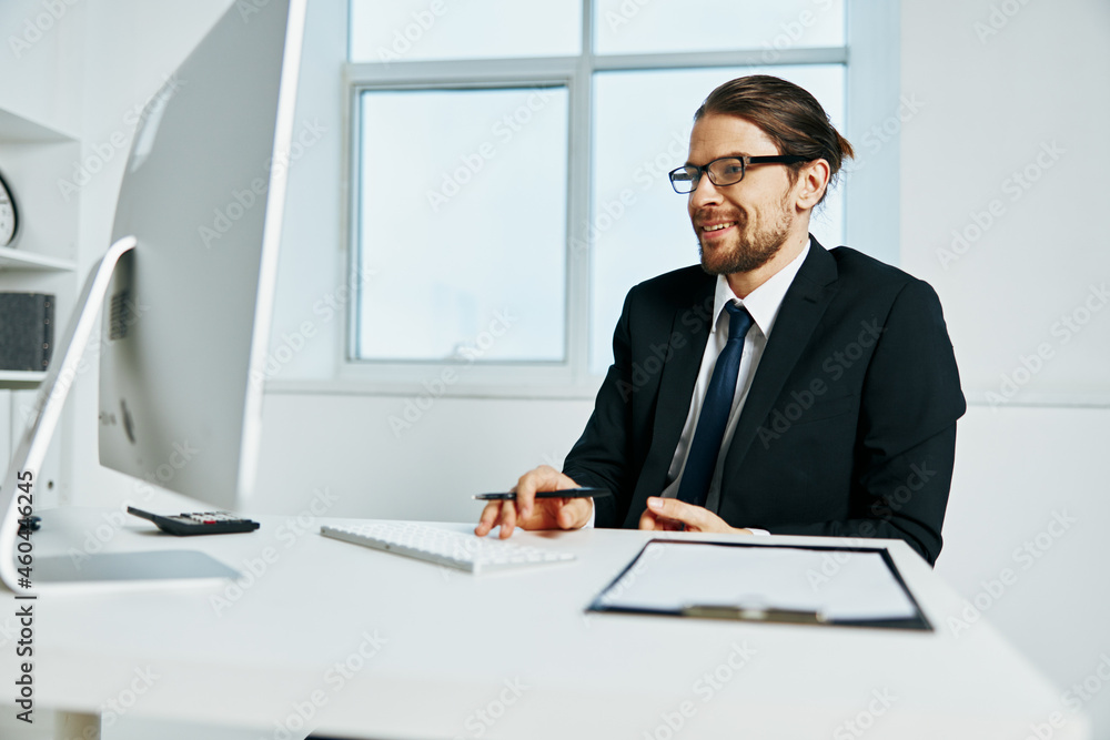 male manager an official is working at the computer Lifestyle male manager an official is working at the computer Lifestyle