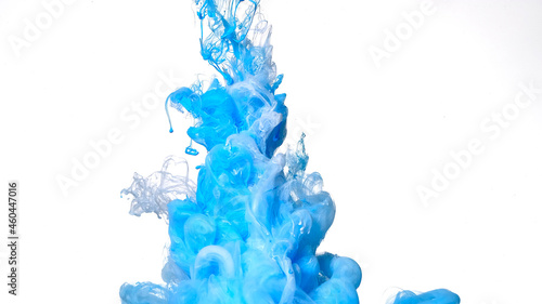 Beautiful abstract background. Blue and white paints are mixed in water. Colored cloud of ink on a white background.