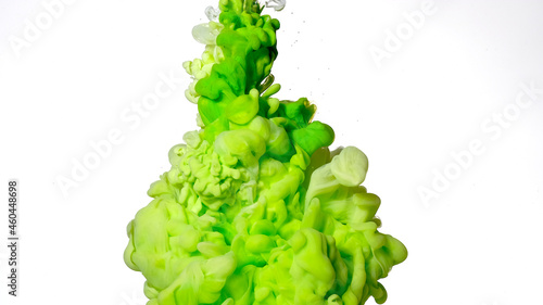 Colored cloud of ink on a white background. Green and white watercolor ink in water on a white background. Beautiful abstract background.