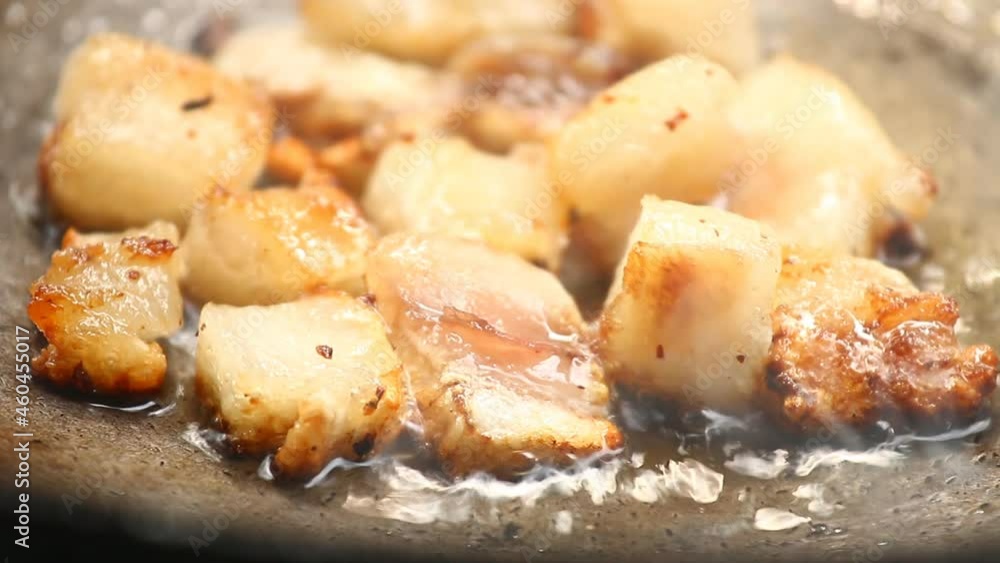 Frying chopped pork fat in pan, in door Chiangmai Thailand Frying chopped pork fat in pan, in door Chiangmai Thailand