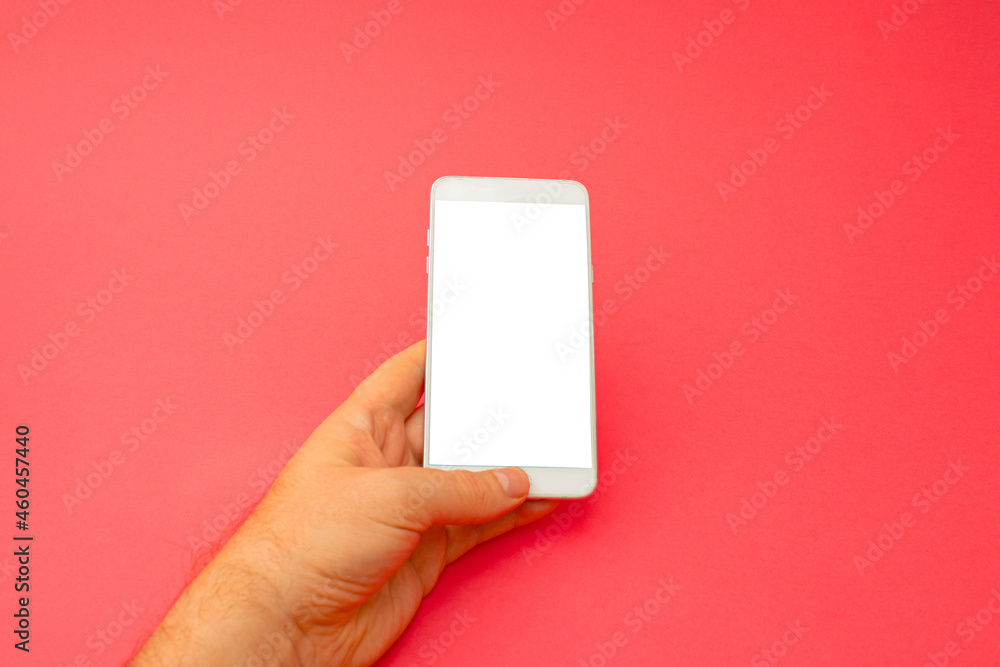 Hand holding white 3d smartphone against red background. 3D illustration design template background. Top mobile phone message. Advertisement idea. Blank copy space for ad. Hand holding white 3d smartphone against red background. 3D illustration design template background. Top mobile phone message. Advertisement idea. Blank copy space for ad.