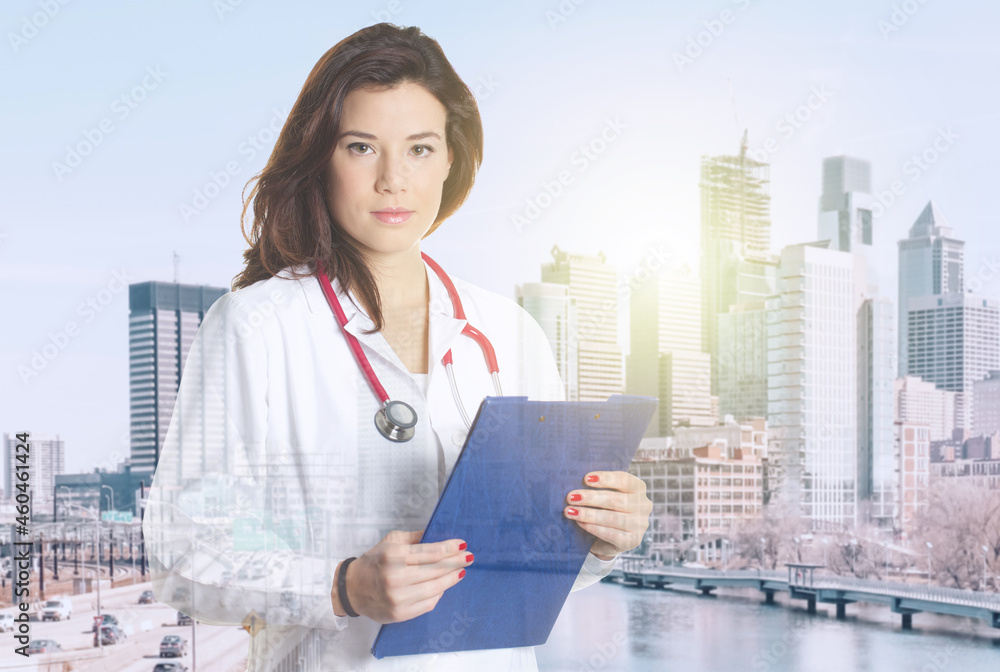 Double exposure of medical doctor working with city 