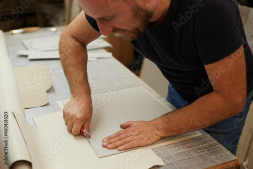 book binder working in a workshop