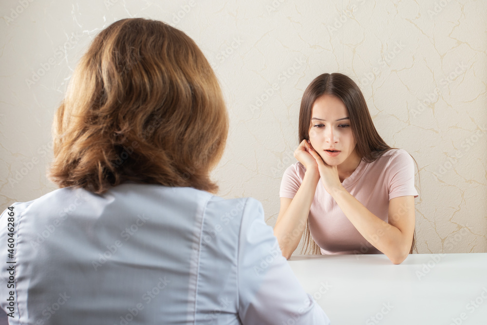 teenage girl at a psychologist's consultation talks about teenage problems, family affairs teenage girl at a psychologist's consultation talks about teenage problems, family affairs