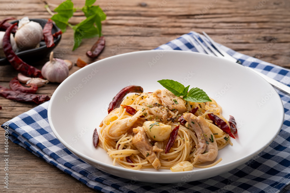 Stir-Fried Capellini pasta With Dried Chili And Sliced chicken on white plate Stir-Fried Capellini pasta With Dried Chili And Sliced chicken on white plate