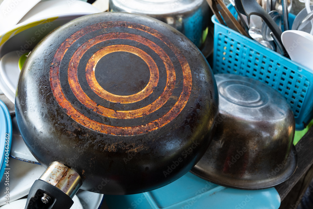 black soot on the bottom of old frying pan.a long time used. Stock