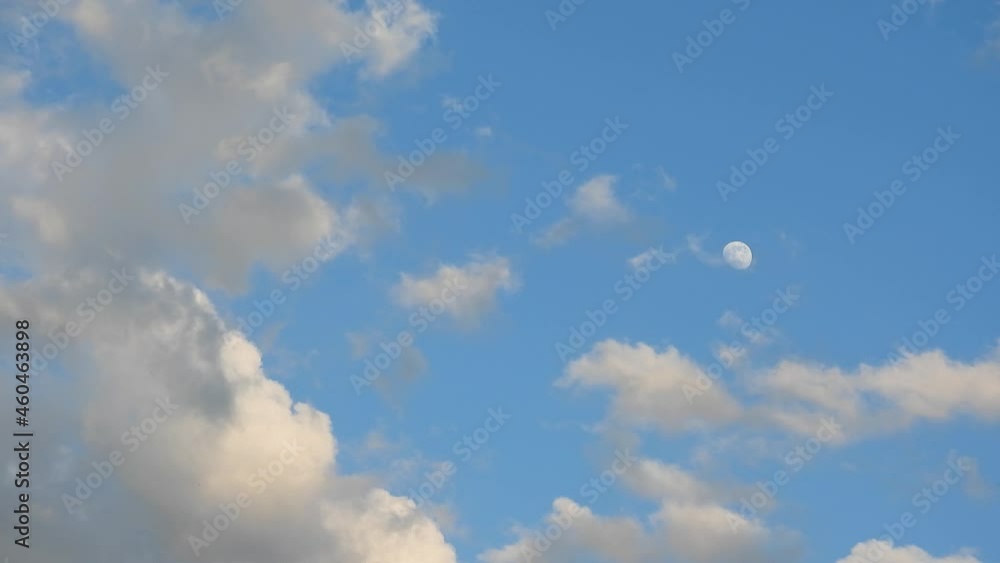 moon in blue sky with floating white clouds, natural sound moon in blue sky with floating white clouds, natural sound