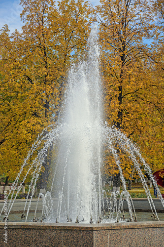 Fountain in a city park on an autumn day