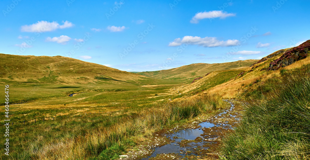 Scenic view of Cwm Hyddgen from the track to the east of the Afon (River) Hyddgen. The peak of Carn Hyddgen can be seen in the distance. Scene of battle by Owain Glyndwr against English rule 1401.