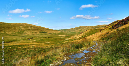 Scenic view of Cwm Hyddgen from the track to the east of the Afon (River) Hyddgen. The peak of Carn Hyddgen can be seen in the distance. Scene of battle by Owain Glyndwr against English rule 1401. photo