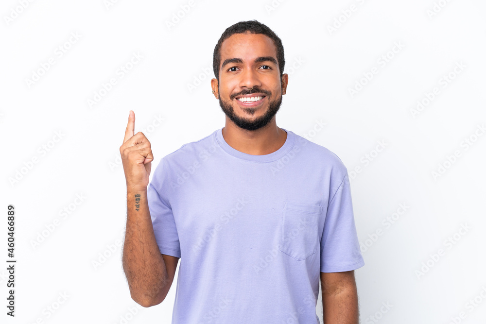 Young Ecuadorian man isolated on white background pointing up a great idea Young Ecuadorian man isolated on white background pointing up a great idea