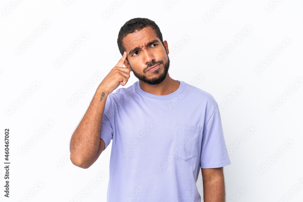 Young Ecuadorian man isolated on white background making the gesture of madness putting finger on the head Young Ecuadorian man isolated on white background making the gesture of madness putting finger on the head