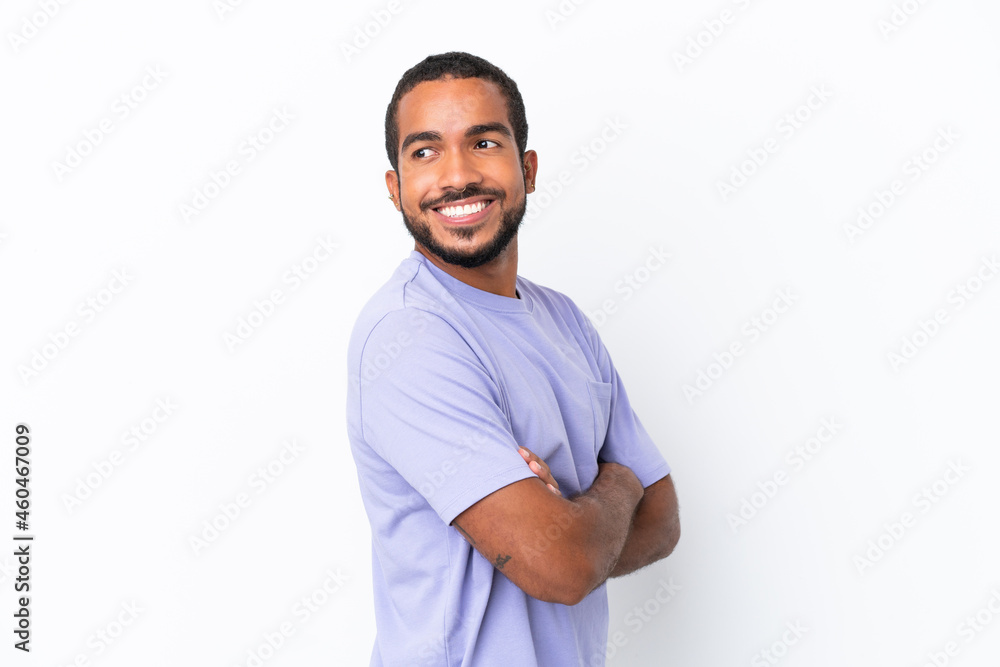 Young Ecuadorian man isolated on white background with arms crossed and happy Young Ecuadorian man isolated on white background with arms crossed and happy