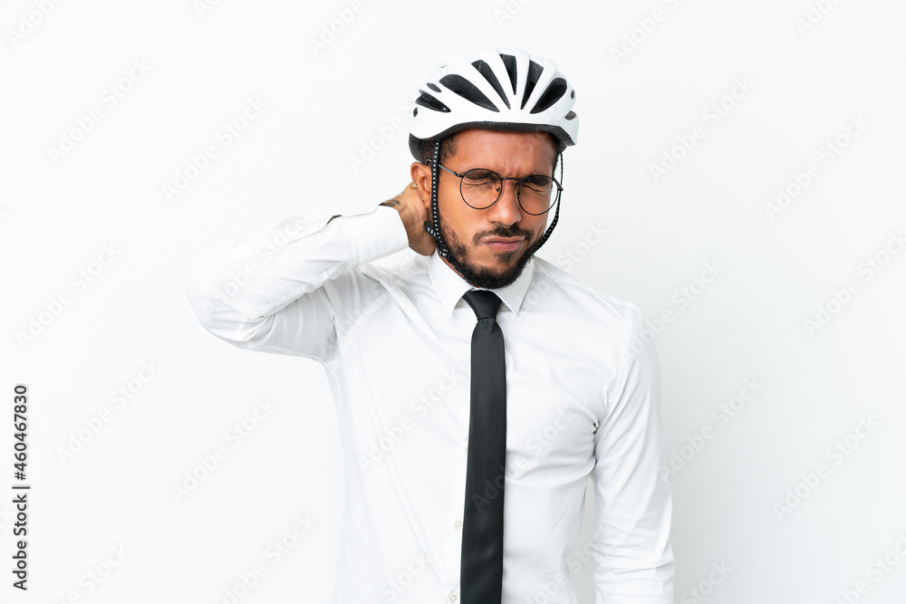 Young business latin man holding a bike helmet isolated on white background with neckache Young business latin man holding a bike helmet isolated on white background with neckache
