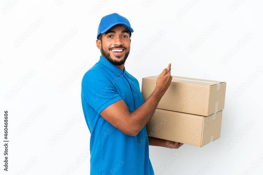 Delivery Ecuadorian man isolated on white background pointing back Delivery Ecuadorian man isolated on white background pointing back
