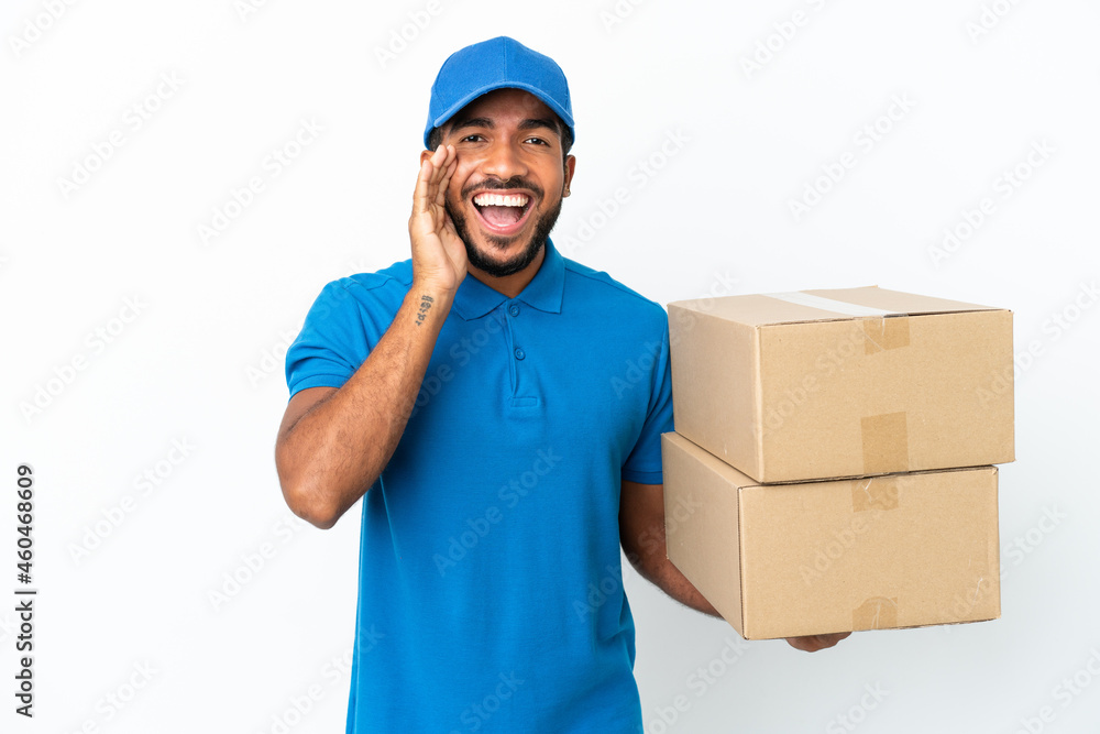 Delivery Ecuadorian man isolated on white background shouting with mouth wide open Delivery Ecuadorian man isolated on white background shouting with mouth wide open