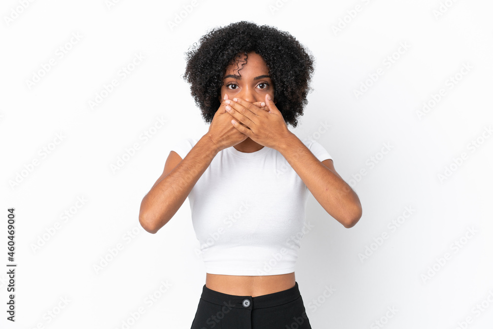 Young African American woman isolated on white background covering mouth with hands Young African American woman isolated on white background covering mouth with hands