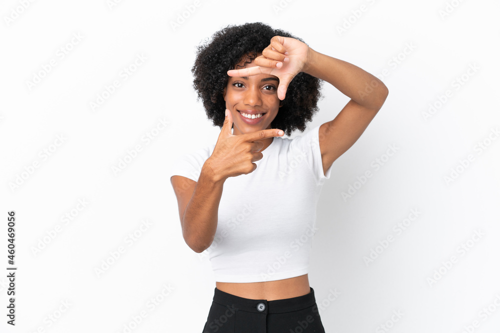 Young African American woman isolated on white background focusing face. Framing symbol Young African American woman isolated on white background focusing face. Framing symbol