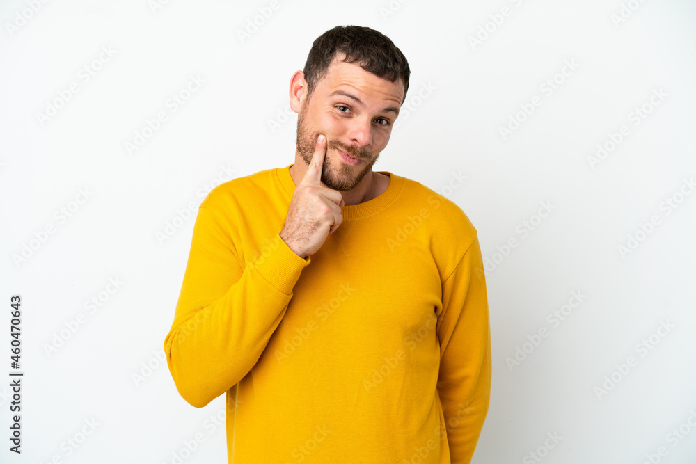 Young Brazilian man isolated on white background and thinking Young Brazilian man isolated on white background and thinking