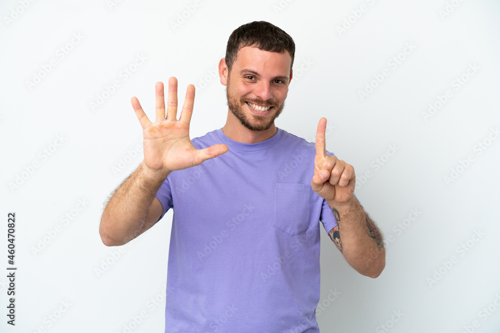 Young Brazilian man isolated on white background counting six with fingers Young Brazilian man isolated on white background counting six with fingers