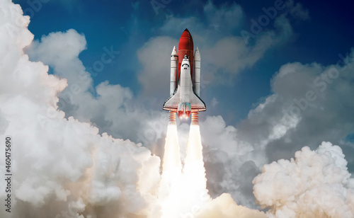 Space shuttle rocket launch in the sky and clouds to outer space. Sky and clo...
