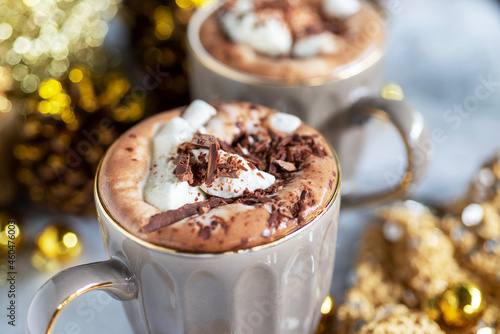 Fototapeta Naklejka Na Ścianę i Meble -  cup of hot chocolate with marshmallows, whipped cream and chopped dark chocolate, hot winter drinks.

