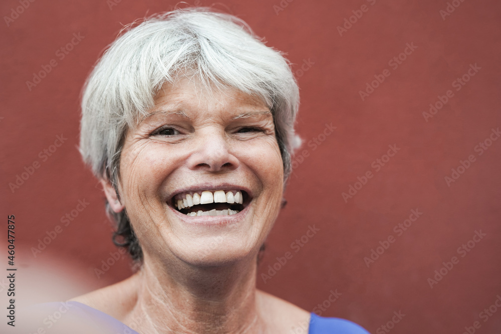 Elderly woman with grey hair taking a selfie using mobile phone - Senior person enjoy technology Elderly woman with grey hair taking a selfie using mobile phone - Senior person enjoy technology
