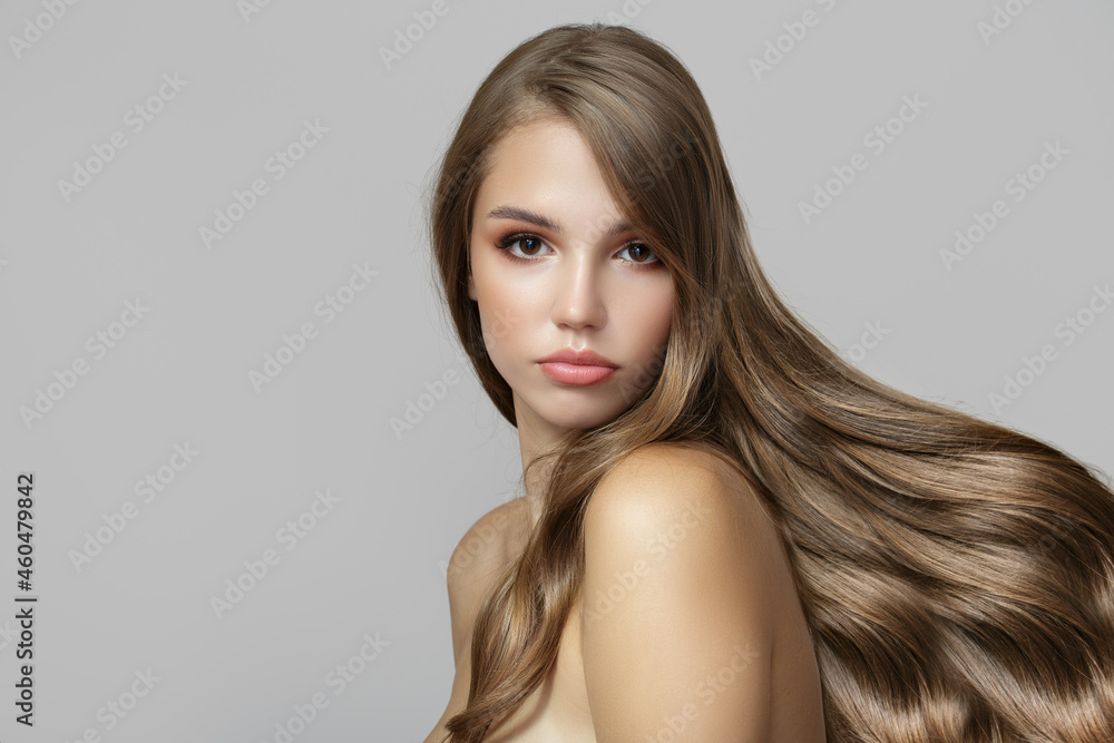 Portrait of a beautiful brunette woman with long wavy hair. Copycpase Portrait of a beautiful brunette woman with long wavy hair. Copycpase
