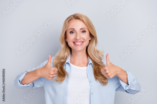 Wallpaper Mural Photo of positive nice lady raise two thumbs up agree toothy smile wear blue shirt isolated grey color background Torontodigital.ca