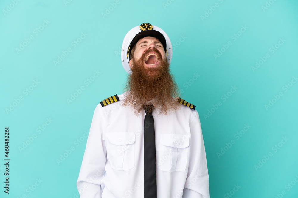 Redhead caucasian man playing rugby isolated on yellow background laughing Redhead caucasian man playing rugby isolated on yellow background laughing