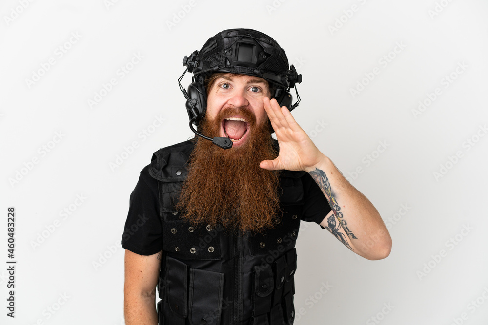 Redhead SWAT isolated on white background shouting with mouth wide open Redhead SWAT isolated on white background shouting with mouth wide open