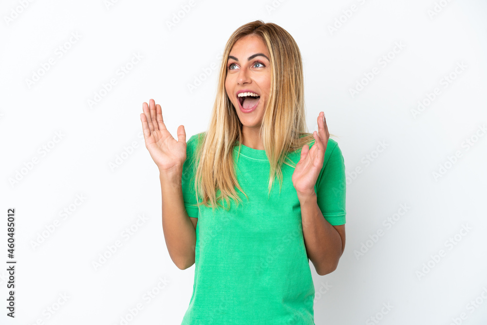 Blonde Uruguayan girl isolated on white background with surprise facial expression Blonde Uruguayan girl isolated on white background with surprise facial expression