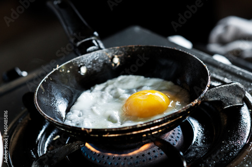 Fényképezés Closeup of cooking an egg in a frying pan