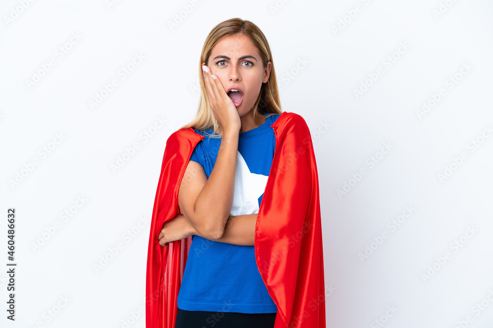 Super Hero caucasian woman isolated background surprised and shocked while looking right Super Hero caucasian woman isolated background surprised and shocked while looking right