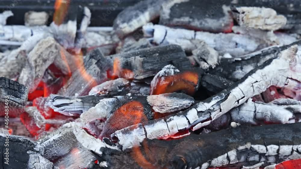 Grilling empty black barbecue with fire grills bright flaming a grill ready for cook meat food Grilling empty black barbecue with fire grills bright flaming a grill ready for cook meat food