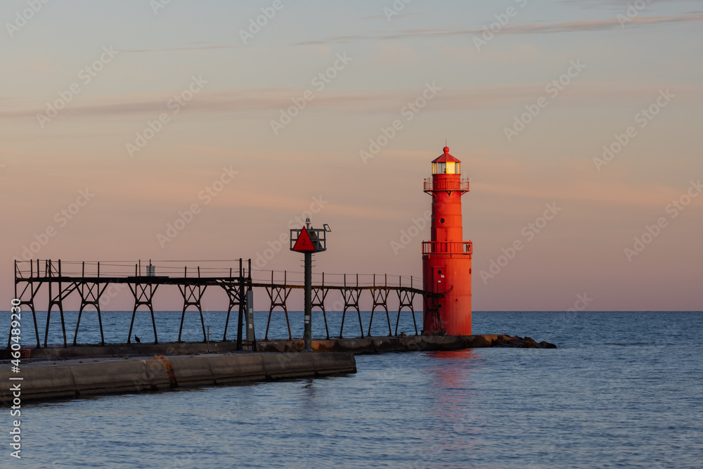 A Red Breakwater Lighthouse Along Lake Michigan