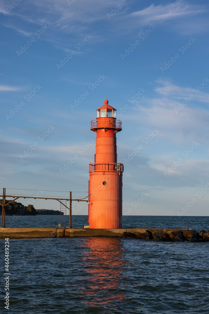 A Red Breakwater Lighthouse Along Lake Michigan