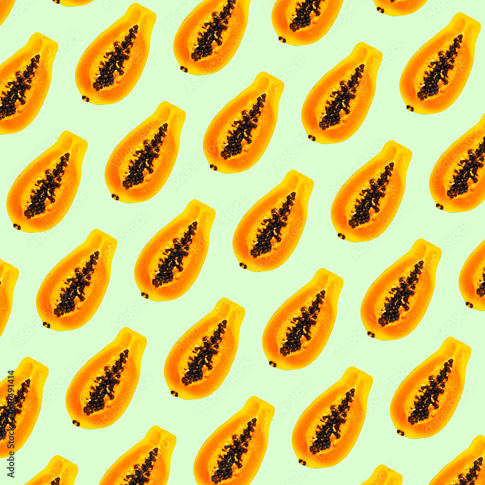 Pattern of Papaya Fruit on Green color background, flat lay, top view, Exotic Fruit Pattern, Food concept Pattern of Papaya Fruit on Green color background, flat lay, top view, Exotic Fruit Pattern, Food concept
