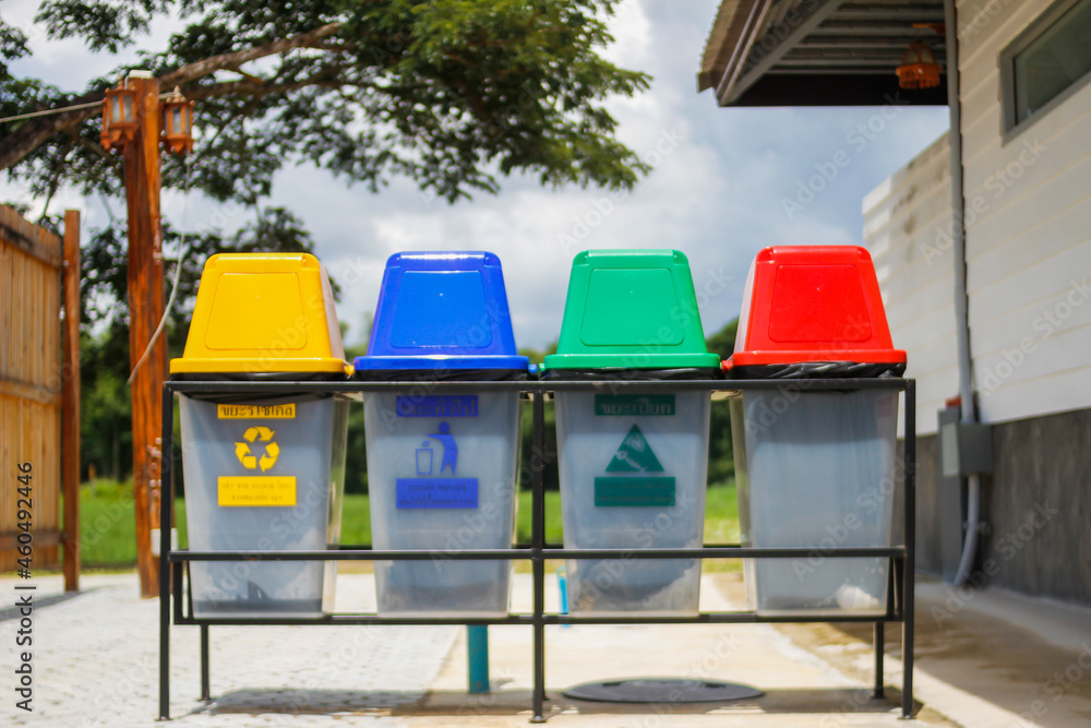 The multi-colored bins are arranged next to each other as bins for sorting waste for recycling and have universal symbols for all tourists to understand in order to separate the waste before disposal. The multi-colored bins are arranged next to each other as bins for sorting waste for recycling and have universal symbols for all tourists to understand in order to separate the waste before disposal.