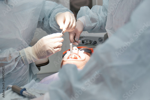 dentist, doctors perform dental surgery, dental implants in the operating room