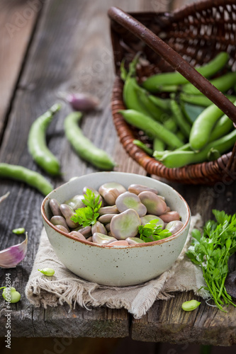 Delicious broad beans boiled with garlic. Healthy country snack. photo