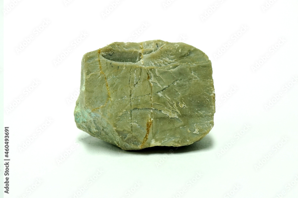 Macro shooting a piece of limestone natural rock isolated on white background. carbonate sedimentary rock. Macro shooting a piece of limestone natural rock isolated on white background. carbonate sedimentary rock.