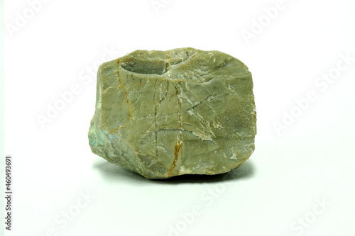 Macro shooting a piece of limestone natural rock isolated on white background. carbonate sedimentary rock.