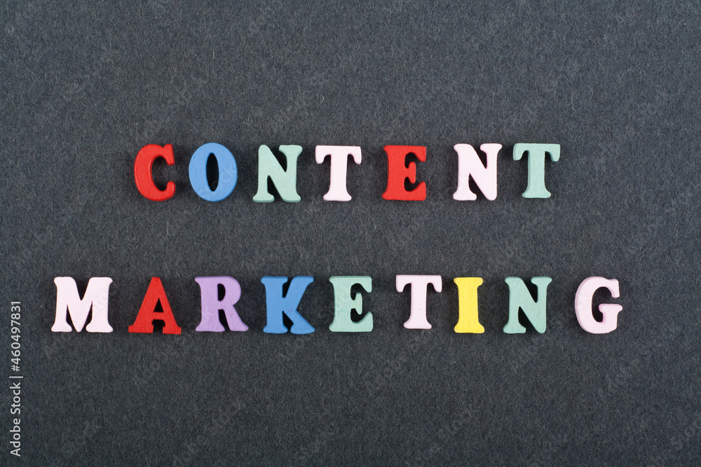 CONTENT MARKETING word on black board background composed from colorful abc alphabet block wooden letters, copy space for ad text. Learning english concept. CONTENT MARKETING word on black board background composed from colorful abc alphabet block wooden letters, copy space for ad text. Learning english concept.